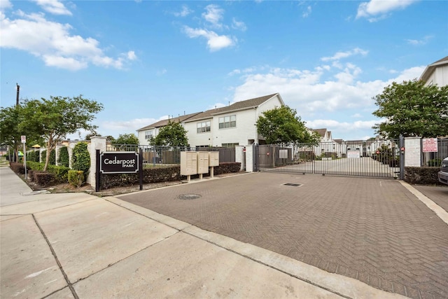 9504 Retriever Way, Houston, TX 77055 - view of street featuring a residential view, a gated entry, a gate, and curbs