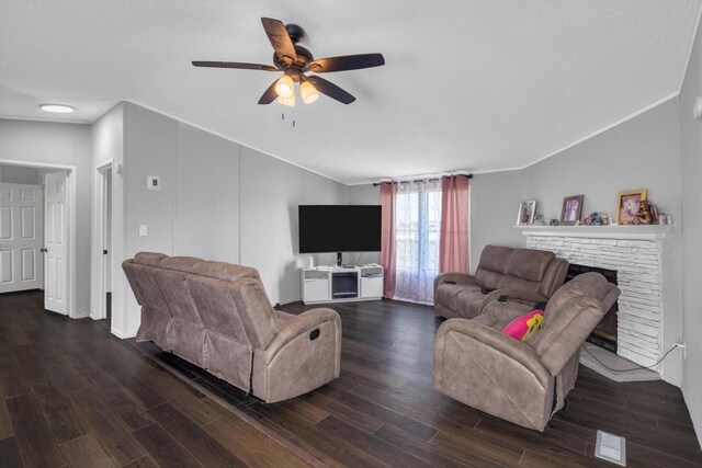 497 Rd 5603, Cleveland, TX 77327 - living area with crown molding, dark wood-style floors, a fireplace, ceiling fan, and vaulted ceiling
