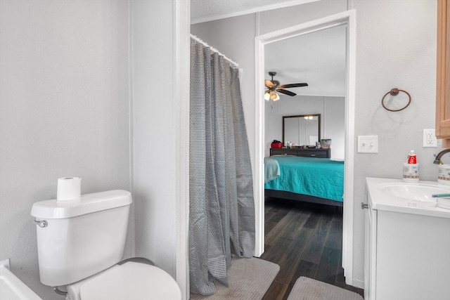 497 Rd 5603, Cleveland, TX 77327 - full bathroom featuring vanity, a ceiling fan, toilet, wood finished floors, and ensuite bath