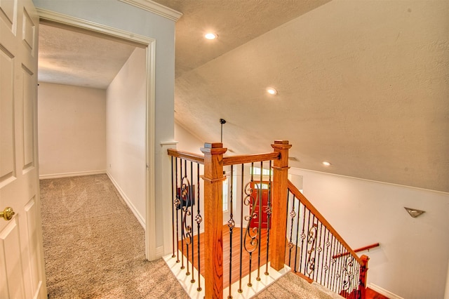 7022 Raven Cliffs Ln, Spring, TX 77379 - stairway featuring a textured ceiling, carpet floors, and recessed lighting