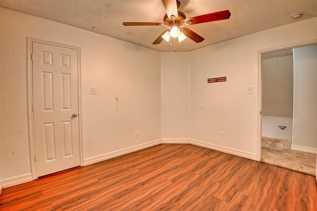 7022 Raven Cliffs Ln, Spring, TX 77379 - unfurnished room with ceiling fan, wood finished floors, and a smoke detector