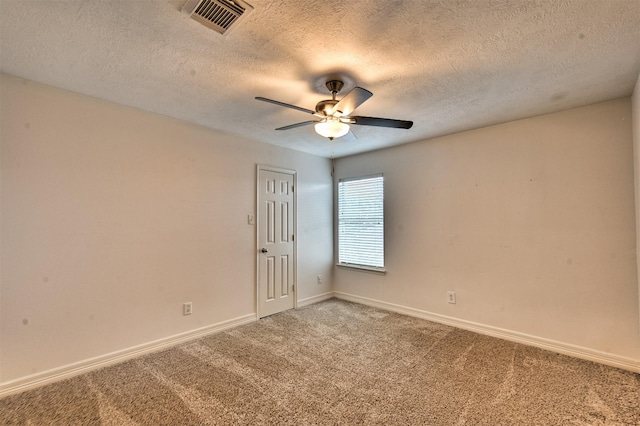 7022 Raven Cliffs Ln, Spring, TX 77379 - empty room featuring light colored carpet, a ceiling fan, and a textured ceiling