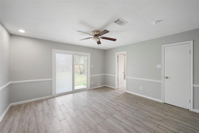 2251 Middle Creek Dr, Houston, TX 77339 - spare room with a ceiling fan, wood finished floors, baseboards, and a textured ceiling