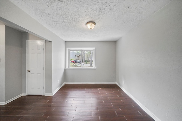 2251 Middle Creek Dr, Houston, TX 77339 - unfurnished room featuring wood finish floors, baseboards, and a textured ceiling