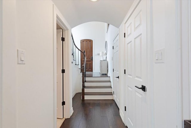 4312 Ascot Ln, Houston, TX 77092 - corridor with arched walkways, dark wood-style floors, baseboards, lofted ceiling, and stairway