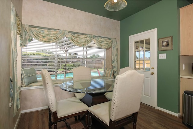 6819 Olympia Dr, Pasadena, TX 77505 - dining area with baseboards and dark wood-style flooring