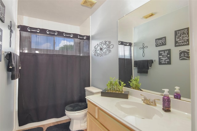 6819 Olympia Dr, Pasadena, TX 77505 - bathroom featuring toilet, vanity, and a shower with shower curtain