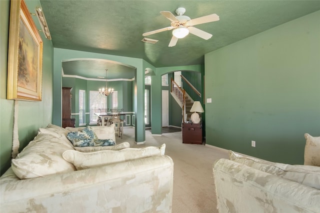 6819 Olympia Dr, Pasadena, TX 77505 - living area with arched walkways, carpet, a chandelier, ceiling fan, and baseboards