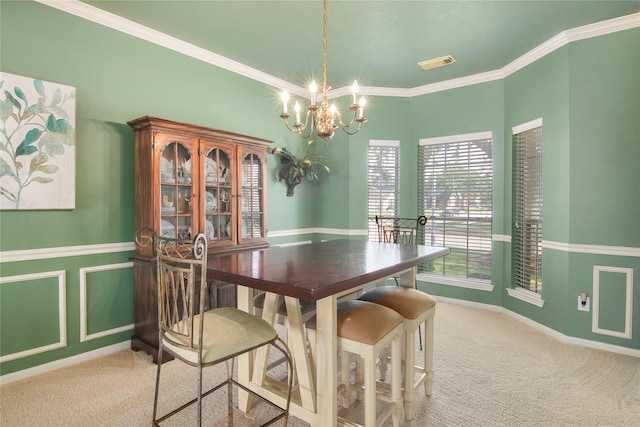 6819 Olympia Dr, Pasadena, TX 77505 - carpeted dining area featuring a chandelier and crown molding