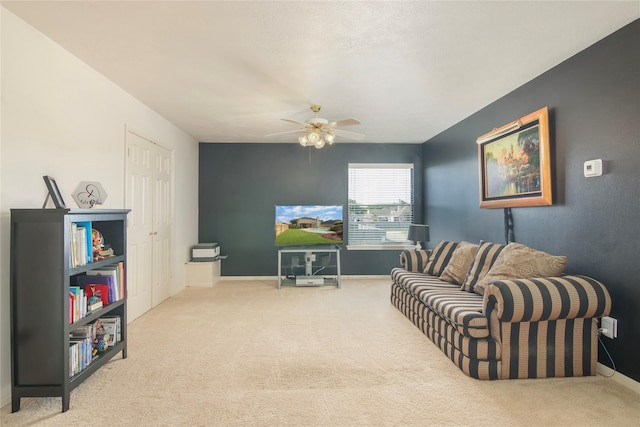 6819 Olympia Dr, Pasadena, TX 77505 - living room featuring carpet flooring, a ceiling fan, and baseboards