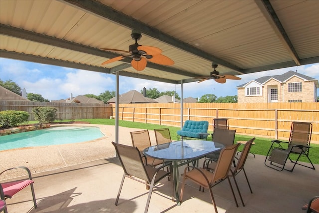 6819 Olympia Dr, Pasadena, TX 77505 - fenced backyard with a ceiling fan, a patio area, and outdoor dining area