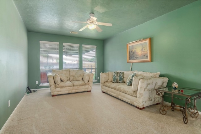 6819 Olympia Dr, Pasadena, TX 77505 - living area featuring a ceiling fan, carpet, a textured ceiling, and baseboards