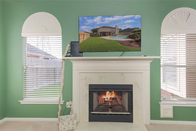 6819 Olympia Dr, Pasadena, TX 77505 - detailed view of a premium fireplace, baseboards, and carpet flooring