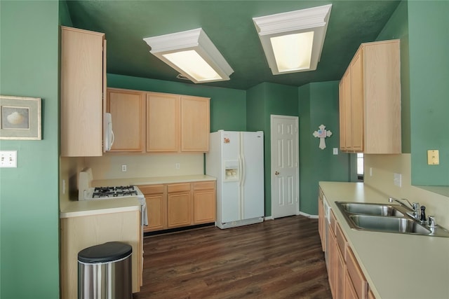 6819 Olympia Dr, Pasadena, TX 77505 - kitchen with light brown cabinets, white appliances, a sink, and dark wood-style floors