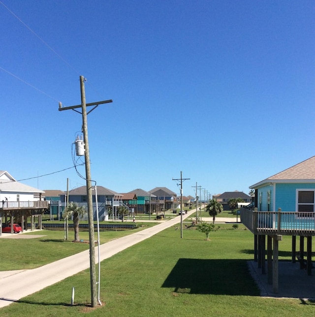 915 Sandollar, Crystal Beach, TX 77650 - view of property's community with a yard and a residential view