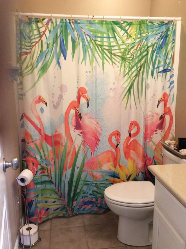 915 Sandollar, Crystal Beach, TX 77650 - bathroom featuring vanity, tile patterned floors, toilet, and a shower with curtain