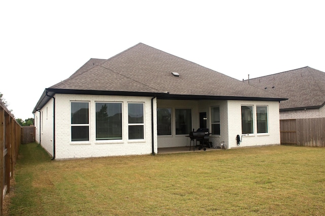 5619 Water Lilies Cor, Manvel, TX 77578 - rear view of property with roof with shingles, brick siding, and a patio area