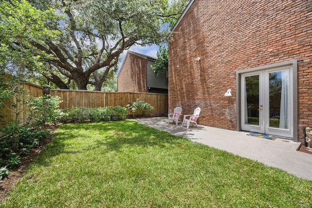 6000 Sugar Hill Dr Unit 1, Houston, TX 77057 - view of yard featuring french doors and a patio