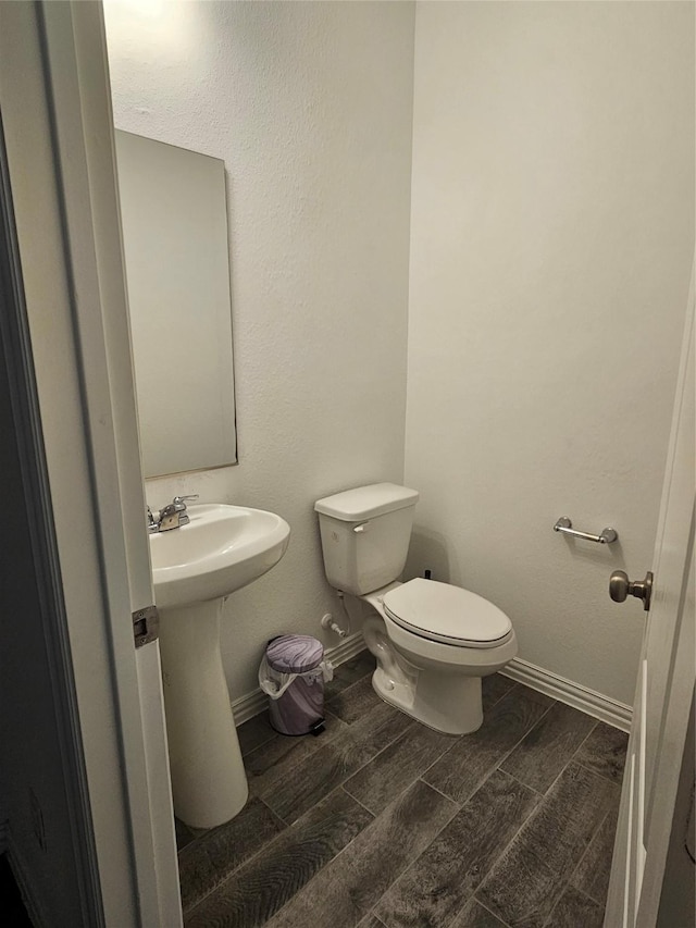 7927 Chukka Dr, Fulshear, TX 77441 - half bathroom featuring toilet and wood tiled floors