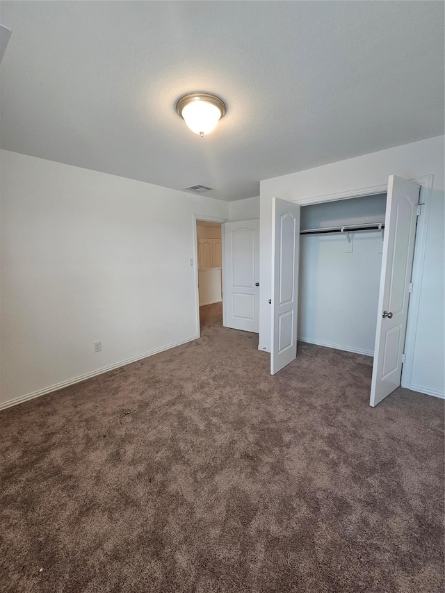 7927 Chukka Dr, Fulshear, TX 77441 - unfurnished bedroom featuring carpet flooring and a closet