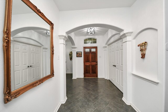 7410 Lassiter Hollow Ln, Richmond, TX 77407 - foyer featuring arched walkways and baseboards