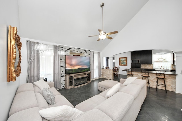 7410 Lassiter Hollow Ln, Richmond, TX 77407 - living room featuring ornate columns, high vaulted ceiling, and ceiling fan