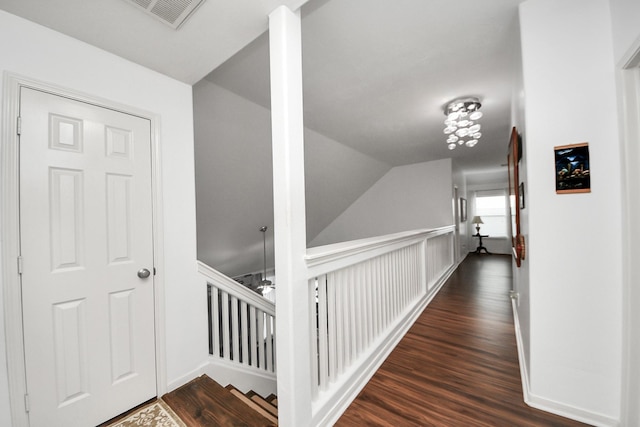 7410 Lassiter Hollow Ln, Richmond, TX 77407 - hall featuring wood finished floors and an upstairs landing