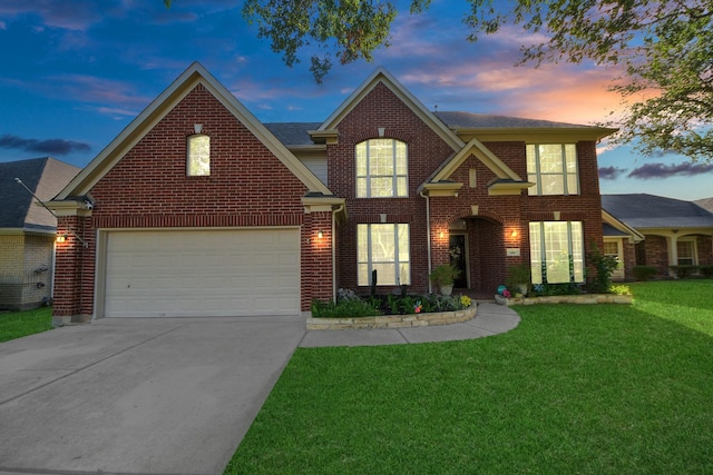 7410 Lassiter Hollow Ln, Richmond, TX 77407 - traditional home with a front yard, concrete driveway, and brick siding