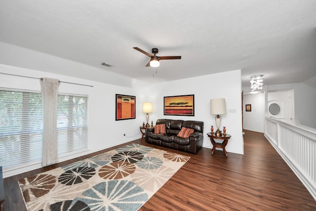 7410 Lassiter Hollow Ln, Richmond, TX 77407 - living area featuring wood finished floors, a chandelier, and ceiling fan