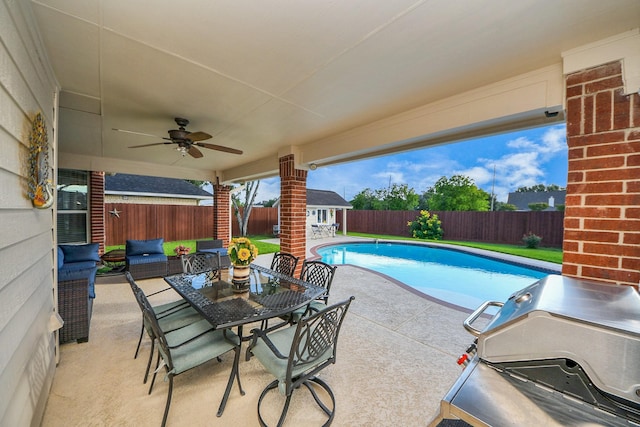 7410 Lassiter Hollow Ln, Richmond, TX 77407 - view of swimming pool featuring a fenced backyard, a ceiling fan, a patio area, and an outbuilding