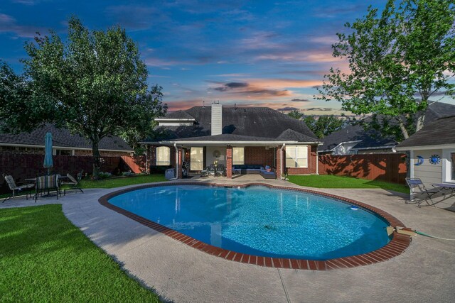 7410 Lassiter Hollow Ln, Richmond, TX 77407 - pool at dusk featuring a patio