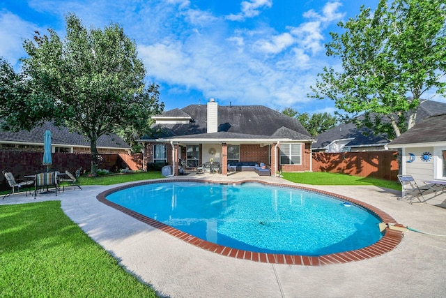 7410 Lassiter Hollow Ln, Richmond, TX 77407 - view of swimming pool with a patio, a fenced backyard, and an outdoor hangout area