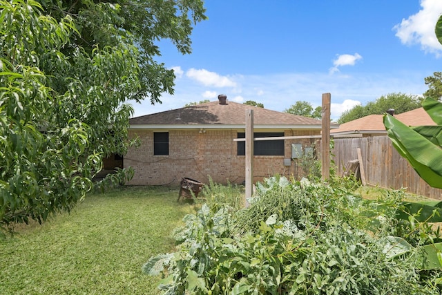 1318 Epsilon St, Pasadena, TX 77504 - rear view of house with brick siding and roof with shingles