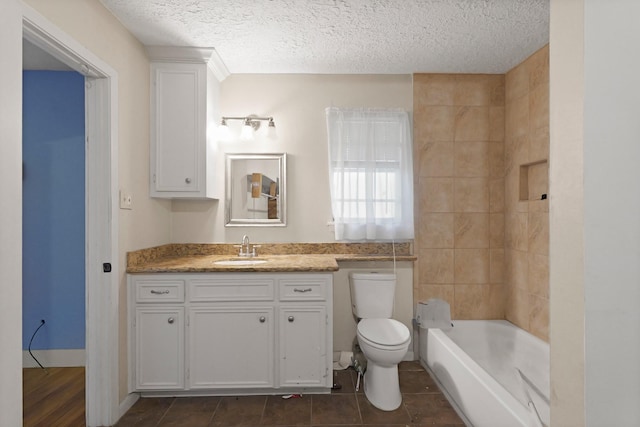1318 Epsilon St, Pasadena, TX 77504 - full bath with toilet, vanity, a textured ceiling, shower / washtub combination, and tile patterned flooring