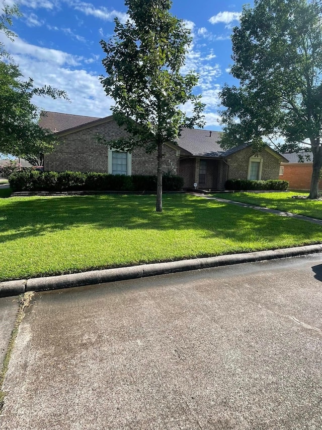 2724 22nd Ave N, Texas City, TX 77590 - view of front of property with a front lawn and brick siding