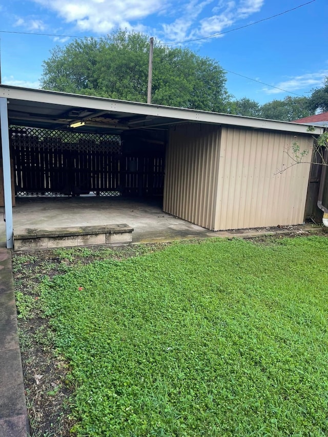 2724 22nd Ave N, Texas City, TX 77590 - view of outdoor structure with an attached carport
