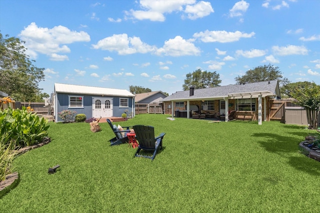 1926 Meadow Creek Dr, Pearland, TX 77581 - back of house with an outbuilding, a patio area, and a gate