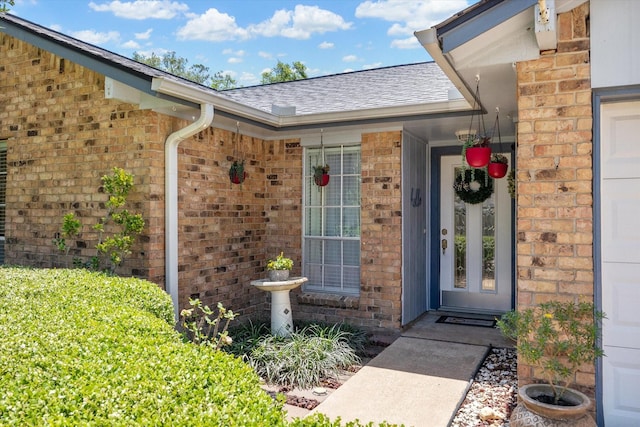 1926 Meadow Creek Dr, Pearland, TX 77581 - doorway to property featuring brick siding and roof with shingles