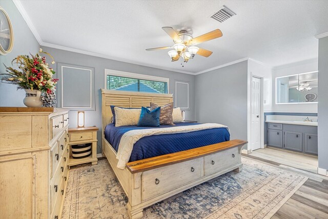 1926 Meadow Creek Dr, Pearland, TX 77581 - bedroom featuring a sink, ornamental molding, light wood-style floors, a ceiling fan, and ensuite bath