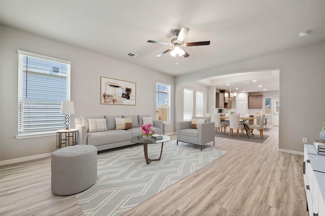 24708 Sonora Crescent Cir, Huffman, TX 77336 - living room with light wood-style flooring, baseboards, a ceiling fan, a chandelier, and recessed lighting