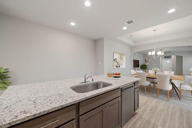 24708 Sonora Crescent Cir, Huffman, TX 77336 - kitchen featuring dishwasher, a sink, light stone counters, pendant lighting, and recessed lighting