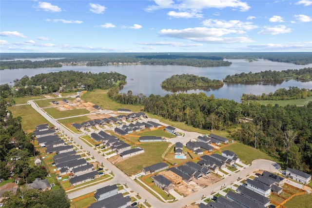 24708 Sonora Crescent Cir, Huffman, TX 77336 - aerial overview of property's location with a heavily wooded area, a large body of water, and nearby suburban area