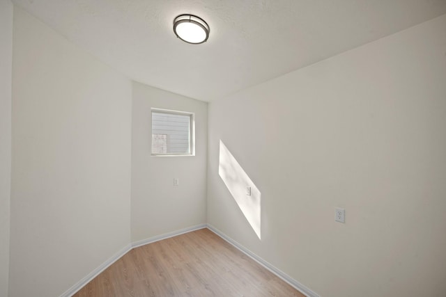 13510 Cedar Point Dr, Cypress, TX 77429 - empty room featuring light wood finished floors, vaulted ceiling, and baseboards
