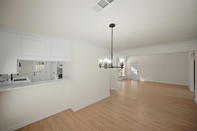 13510 Cedar Point Dr, Cypress, TX 77429 - unfurnished dining area featuring a chandelier, light wood-type flooring, ornamental molding, and baseboards
