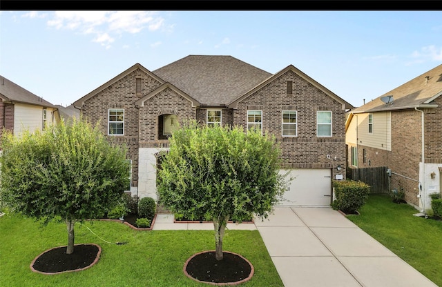 20714 Fertile Valley Ln, Richmond, TX 77407 - view of front of home featuring brick siding, an attached garage, and driveway