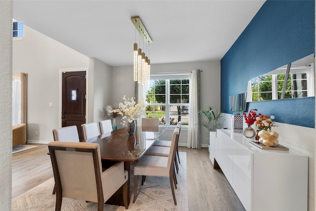 20714 Fertile Valley Ln, Richmond, TX 77407 - dining area with light wood-style floors and baseboards