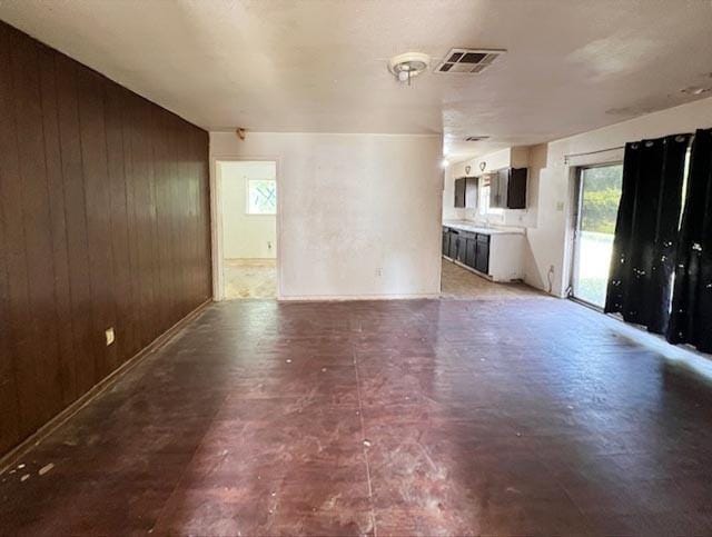 12922 Claygate Dr, Houston, TX 77047 - unfurnished living room with wooden walls