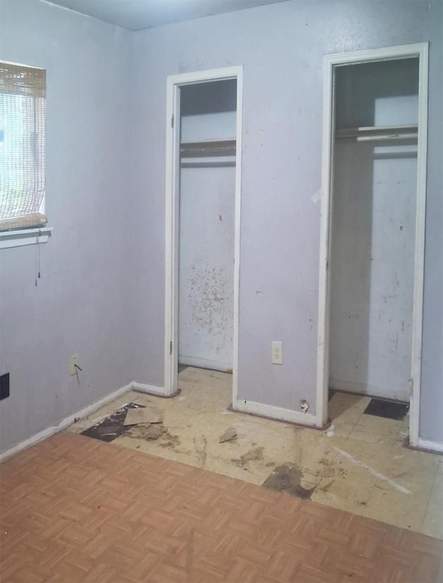 12922 Claygate Dr, Houston, TX 77047 - unfurnished bedroom featuring two closets