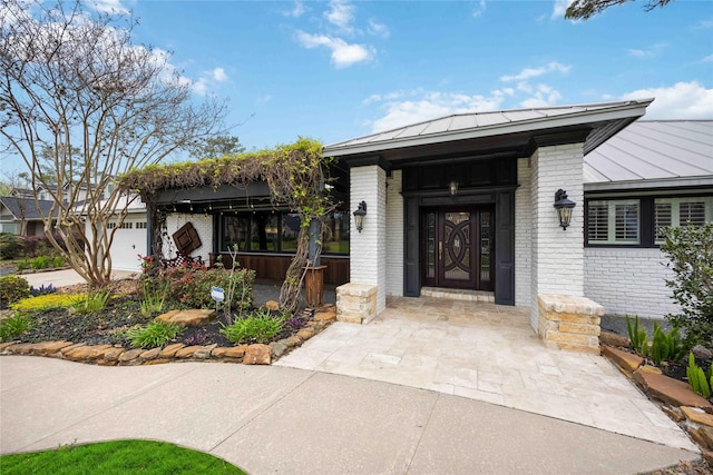 4031 Fernwood Dr, Houston, TX 77021 - property entrance with brick siding, a standing seam roof, and a metal roof