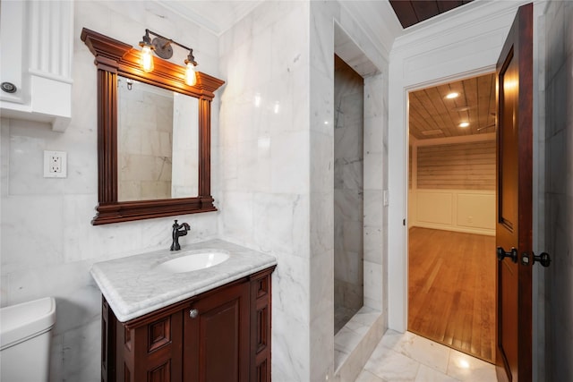 4031 Fernwood Dr, Houston, TX 77021 - full bathroom with vanity, a walk in shower, crown molding, marble finish floors, and tile walls
